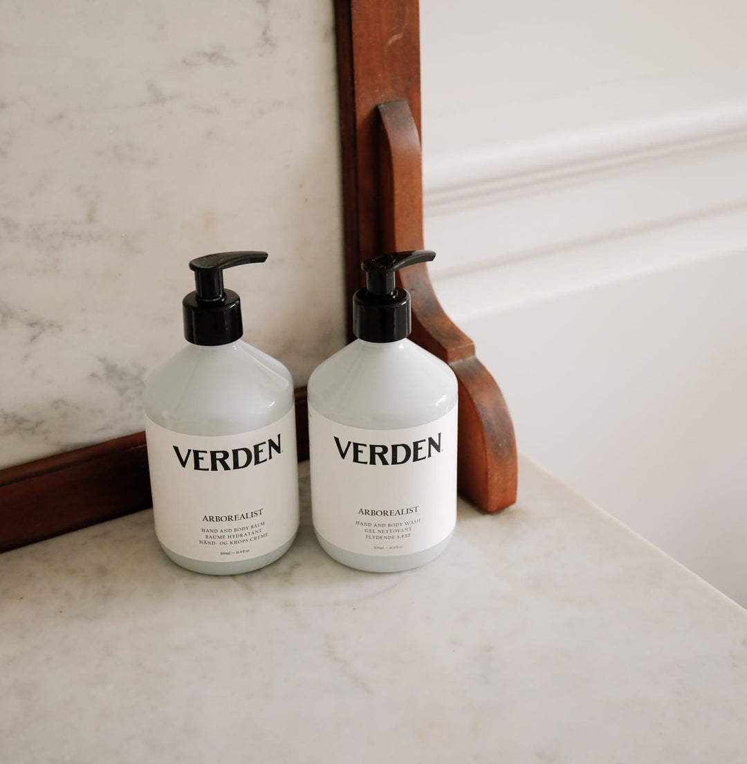 Arborealist Hand and Body Wash and Hand and Body Balm on marble