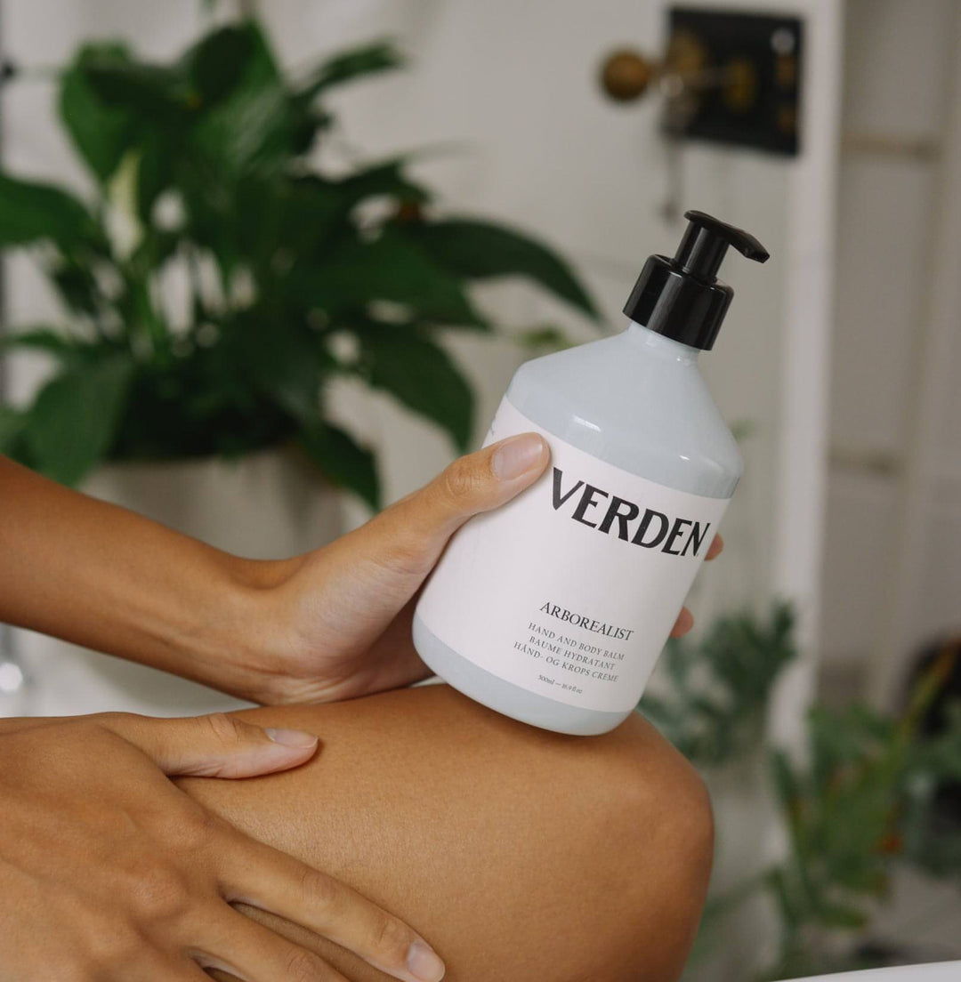 Arborealist Hand and Body Balm held by figure