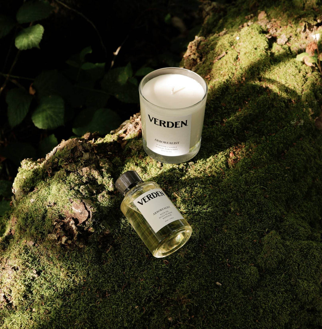 Arborealist Bath Oil and Scented Candle on moss