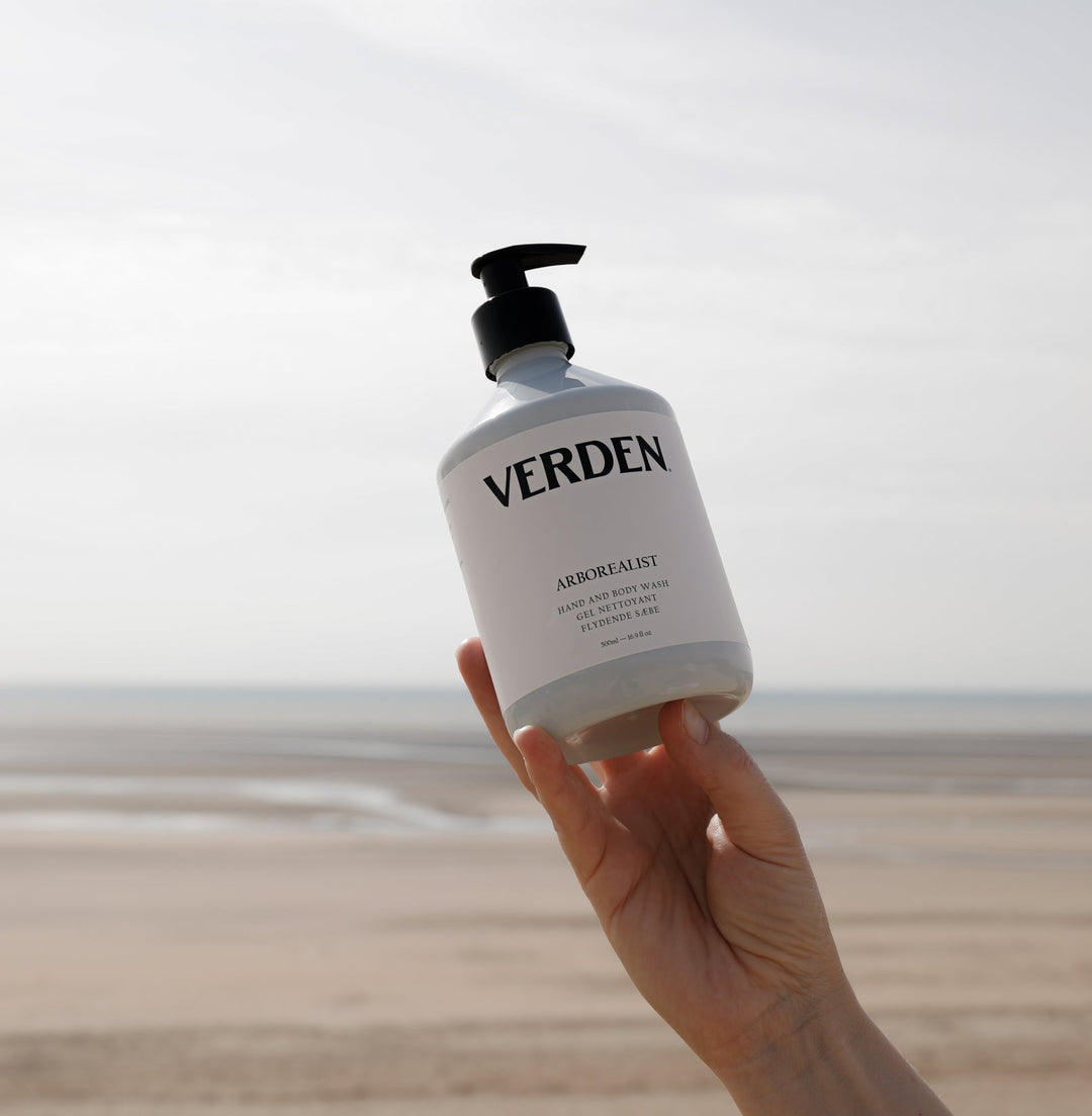 Arborealist Hand and Body Wash held above sea