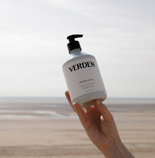 Arborealist Hand and Body Wash held above sea