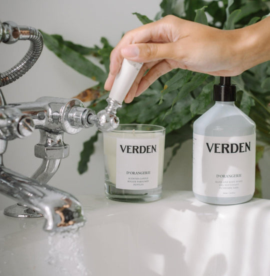 D'ORANGERIE Scented Candle and Hand and Body Wash on bathtub