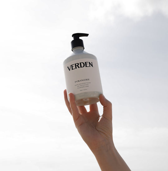 D'Orangerie Hand and Body Wash held in sky