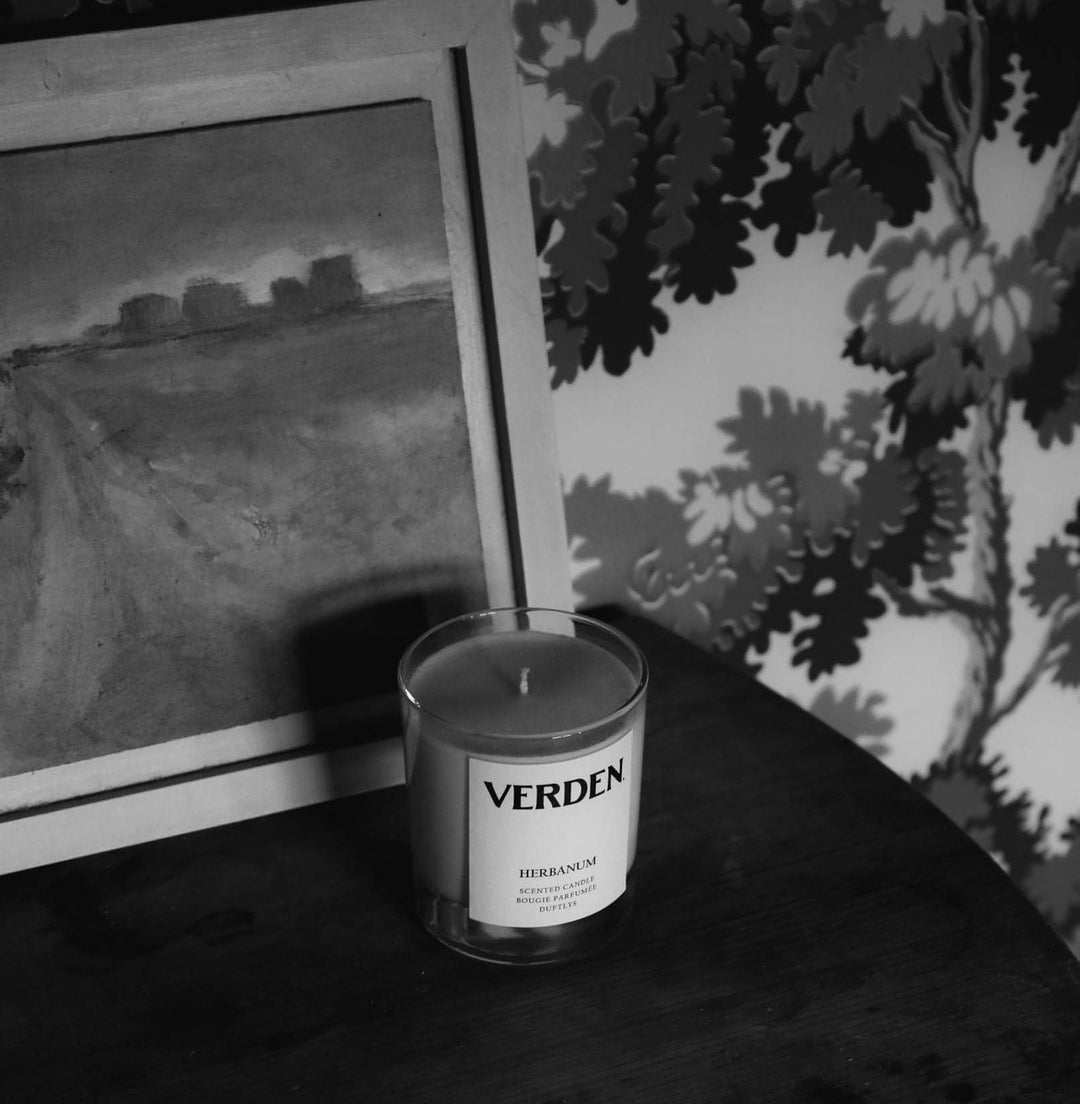 Herbanum Scented Candle on table